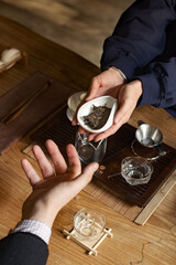 The Art of Tea Handing Over Loose Leaves in a Calm and Serene Setting for Everyone