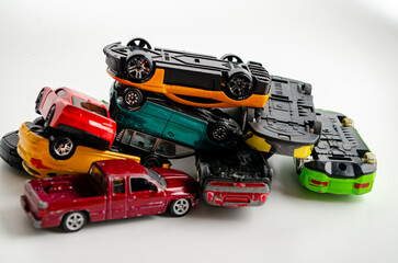 Obraz premium a group of small toy cars piled up in a heap
