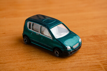 Obraz premium A small toy car made of plastic 