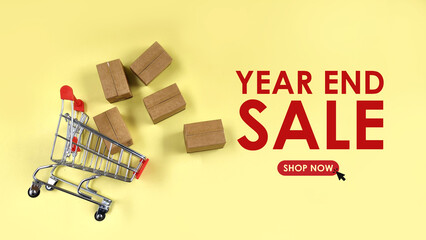 bulk parcel boxes and shopping cart with year end sale text. sales, offer, online shopping concept 