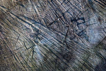 Close-up of weathered wood grain, showing intricate lines and textures.  A natural, rustic background.