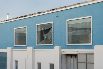 Building windows covered in plastic. Refurbishing of a building