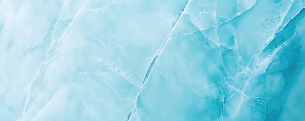 Obraz premium A serene, textured background featuring soft blue hues, reminiscent of ice or water, with subtle white veins running through.