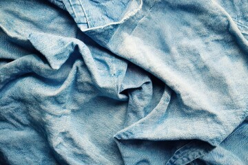 Texture of old pale blue denim fabric.