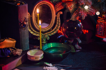Candle burns on the altar, magic among candles, clean negative energy, magical concept, winter time	