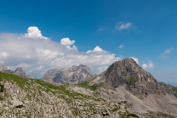 Scenic view of cloud covered rocky rugged mountain peak of Cima Dei Lasteri in majestic Brenta Dolomites, Trentino, Italy. Wanderlust in alpine wilderness. Hiking in pristine Italian Alps in summer