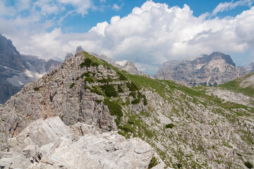 On top of Croz dell'Altissimo with panoramic view of majestic cloud covered rugged mountain peak Cima Sophia in Brenta Dolomites, Trentino, Italy. Summer wanderlust in alpine wilderness Italian Alps