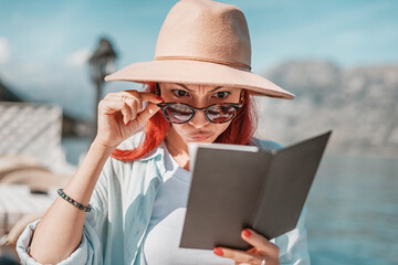 Shocked Woman Reacting to High Prices at a Seaside Cafe or Restaurant
