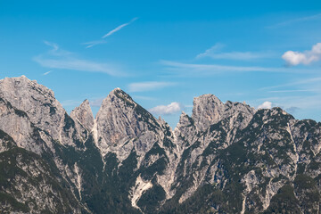 Scenic view of pristine rugged mountain peaks of Western Julian Alps, Italy, Europe. Wild hiking...