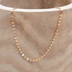 close up Gold sequin chain permanent jewelry necklace