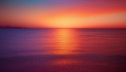 Fototapeta premium Sunset Symphony: A breathtaking panorama of the horizon, where the sun dips below the water, painting the sky in vibrant hues of orange, pink, and purple, creating a mesmerizing symphony of color 