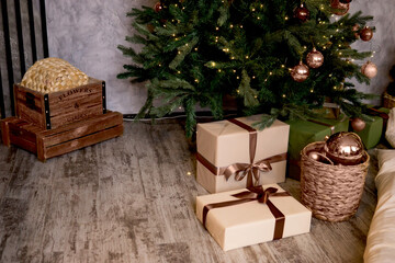 Bronze balls on the Christmas tree close-up. Christmas tree design decorations. Color of 2025 year - Mocha Mousse