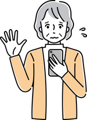 スマホを操作して困っているシニア