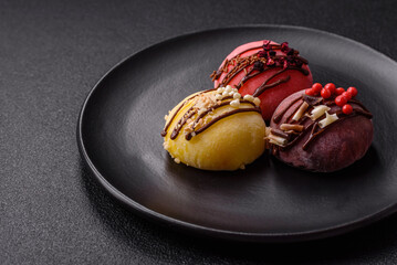 Delicious colorful asian mochi sweets with rice dough shell and fruit filling