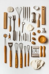 Wooden-handled tools, dough, flour, and small objects.