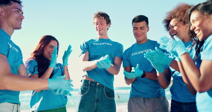People, hand stack and volunteering on beach of cleaning environment, earth day and community service. Group, collaboration and recycling trash with ocean dirt, waste management and pollution project