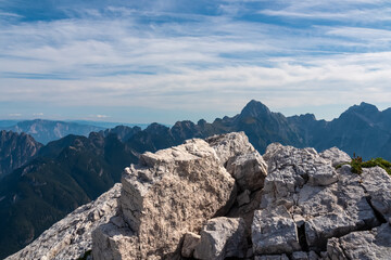 On top of mount Cima Del Lago overlooking majestic mountain ridges of Julian Alps, border Italy...