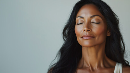 Fototapeta premium Peaceful Woman with Closed Eyes and Natural Beauty