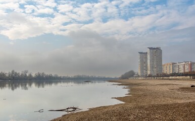 the bank of the shallow Kuban River near the city of Krasnodar (South of Russia) with wild birds in...