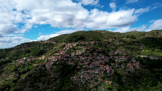 4K Aerial view of the beautiful Lagkadia village (or Lagadia), a traditional mountainous settlement at the evergreen Arcadia region, in Peloponnese, Greece, Europe