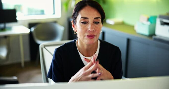 Dental, woman and computer in office at hospital for reading patient record, oral diagnosis review or online research. Doctor, mature professional or tech at dentist for implant analysis or treatment