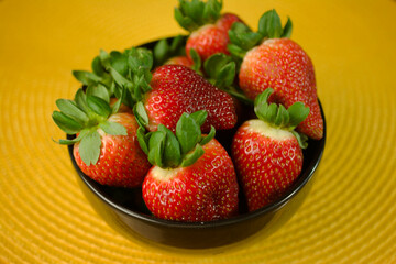 Ripe Strawberries in Black Ceramic Bowl