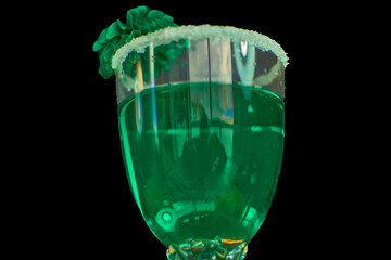 St. Patrick’s Day festive green drink with sugar rim and green accents on black