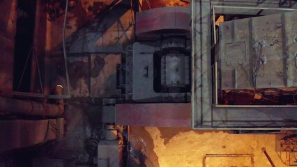 An Overhead View of Industrial Machinery in a Dimly Lit Environment for Insightful Analysis. Stock Clip