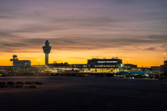 Silhouette of airport control tower Schiphol Amsterdam in sunset sky