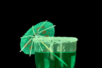 St. Patrick’s Day festive green drink with sugar rim and green accents on black
