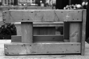 Gray wooden stool in the table