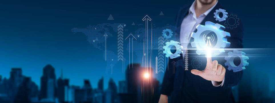 Telecommunications: Connectivity, networking, signal processing, mobile technology, IoT integration, 5G infrastructure. Businessman hand holds telecommunications icon and network on digital interface.