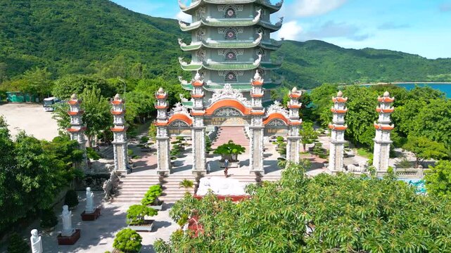 Thap Xa Loi is a serene Buddhist temple in Da Nang featuring an impressive reclining Buddha statue surrounded by lush greenery and meticulously landscaped gardens.