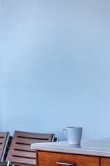 A coffee cup on the table on a cruise ship.