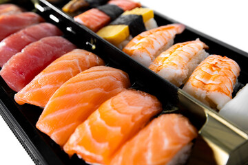 fresh Japanese sushi set bento with freshness of salmon, tuna, prawn, alaska, crab, eel, and fresh sashimi on Japanese rice
