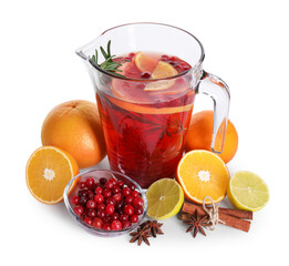 Aromatic punch drink in glass jug and ingredients on white background