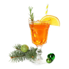 Tasty Christmas cocktail in glass, baubles and fir tree branches isolated on white
