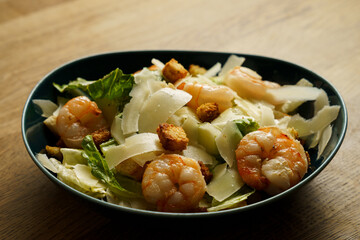 Shrimp Caesar salad with croutons and parmesan