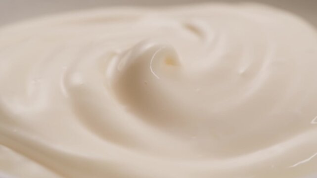 Pouring mayo white creamy sauce close-up in cafe restaurant. Cooking fast food fries with mayonaise sauce. Fast and junk food concept.