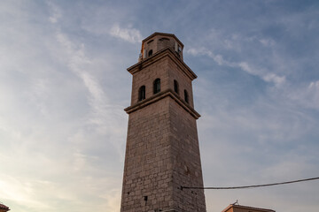 Obraz premium Scenic view of bell tower of Church of St. Lovro in Premantura, Kamenjak National Park, Istria, Croatia. impression is one of timeless beauty and architectural grandeur. Sunset atmosphere in summer