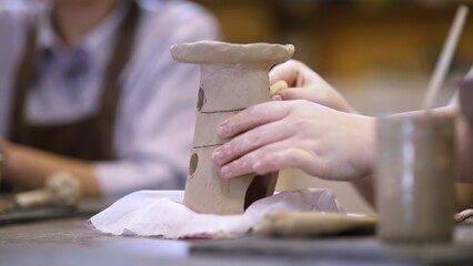 Join our Creative Pottery Workshop to craft unique clay creations with various techniques. Stock Clip