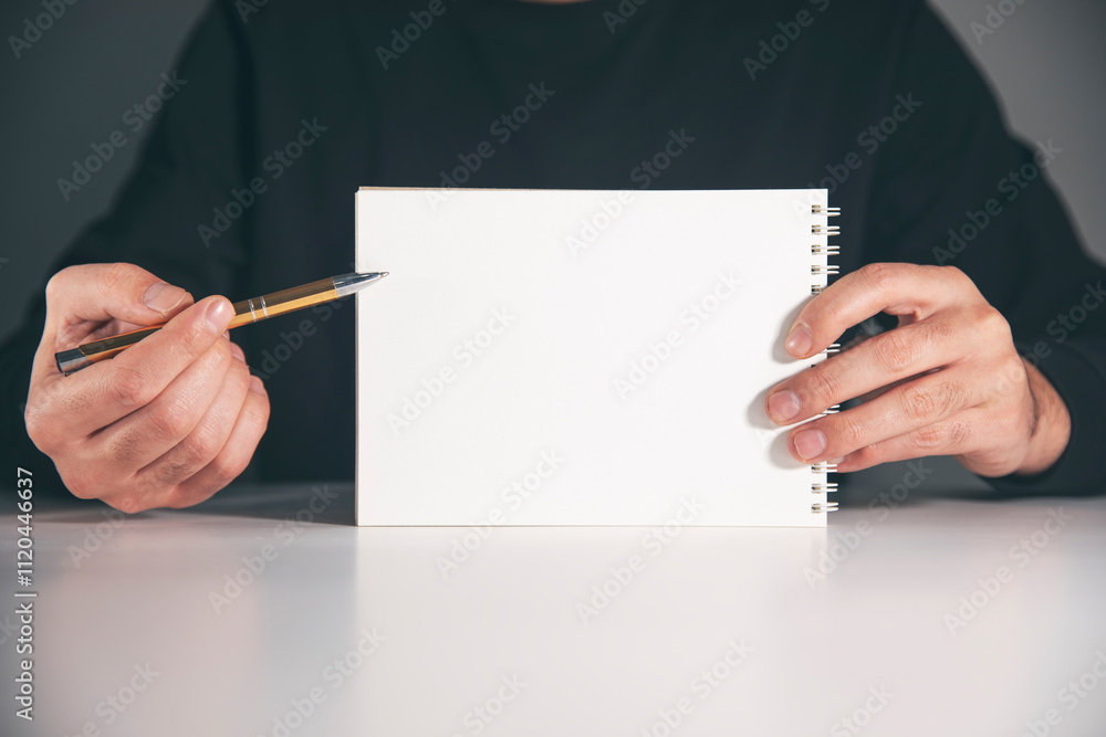 Poster man writing notes in notebook