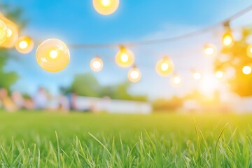 Obraz premium Warm string lights hang over a grassy area on a sunny day, creating a cozy outdoor ambiance with blurred figures in the background.
