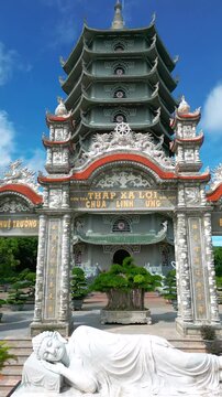 Thap Xa Loi is an impressive Buddhist temple in Da Nang featuring intricate architecture and a serene reclining Buddha statue surrounded by lush greenery.