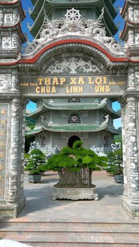 Thap Xa Loi is an intricate Buddhist temple in Da Nang, featuring elaborate architecture, lush greenery, and carved stone details, embodying spiritual tranquility.