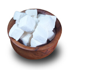 White Marshmallows in a wooden bowl or a cup. Cup full of marshmallows with copy space.