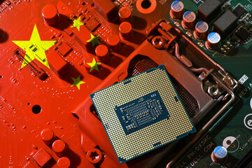 Flag of the Republic of China on a red painted pc motherboard with a CPU. Concept for supremacy in...