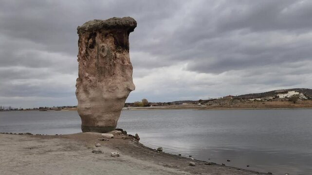 Magical rock formations by the side of the Lake Emre which is a serene natural oasis, surrounded by lush greenery and ancient rock formations in the heart of Phrygian Valley in Afyonkarahisar.
