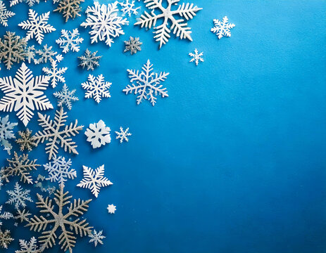 beautiful festive silver snowflakes, sparkling holiday decorations on blue background
