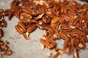 close-up of roasted pecans on wax paper, baking, culinary